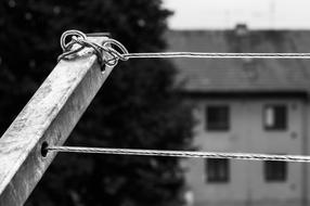 Black and white photo of a stretched cable