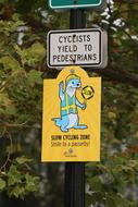 Cyclist Pedestrians Slow Zone sign