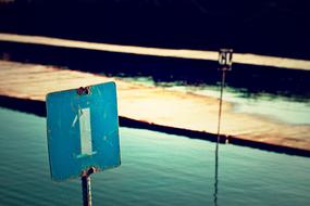 road sign by the water