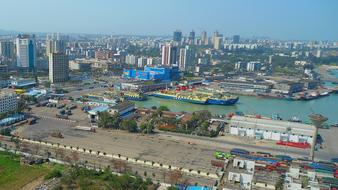 ships in harbor at contemporary city, China, Haikou