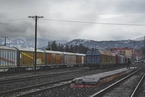 cargo Train on Railway near mountains