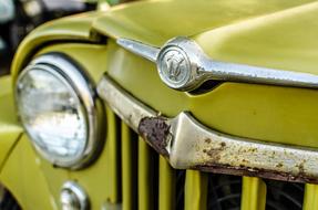 the yellow car is old