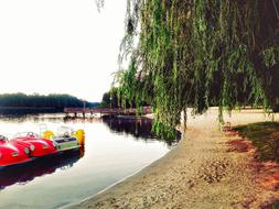 colored ships on the lake