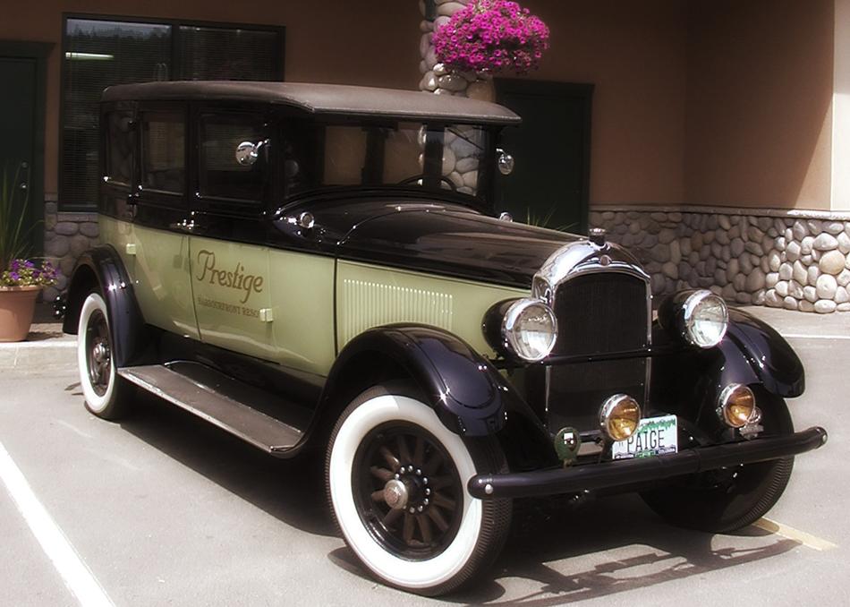 black green vintage car in the museum