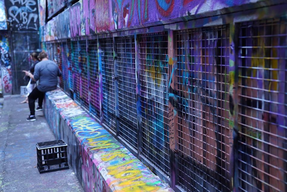 young people at colorful grunge wall with grid