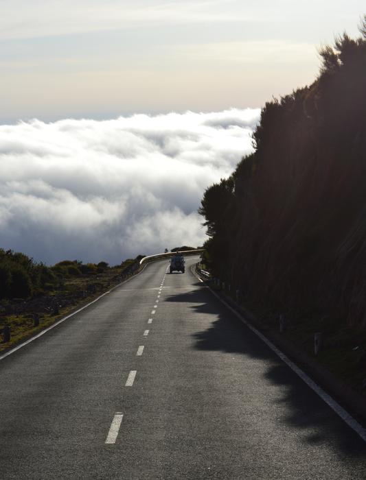 Auto on Road and Clouds