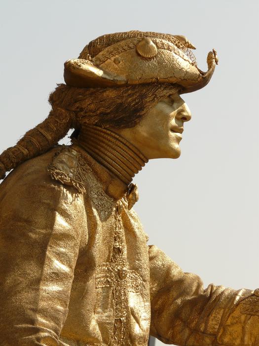 gold statue of a man