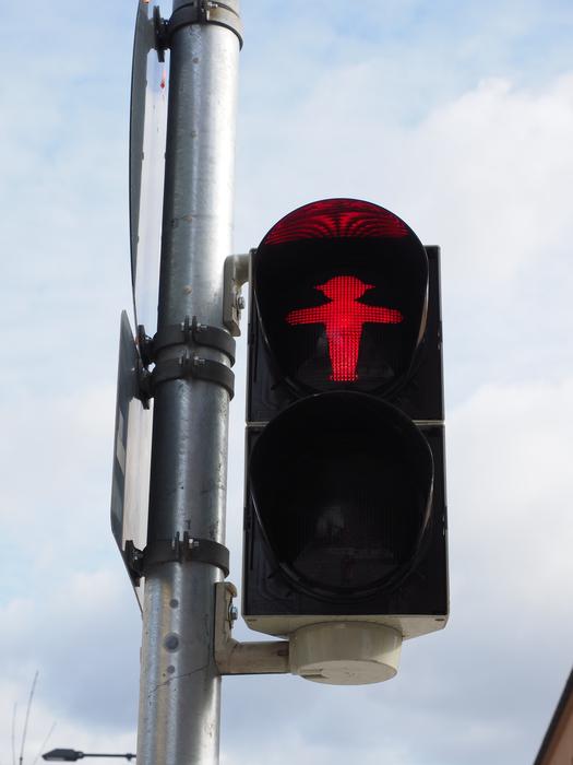 red traffic light on footbridge