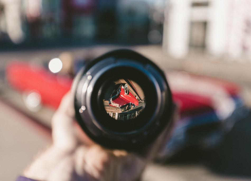 camera lens in hand