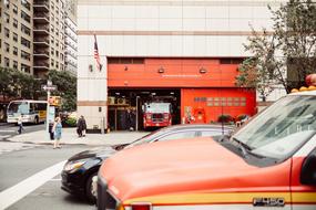 orange car on the road