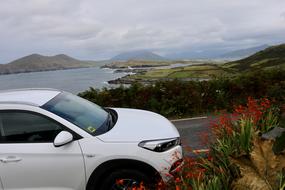 white car against the sea