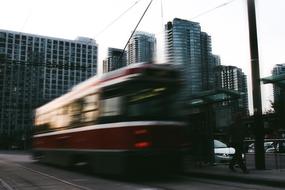 fast streetcar against the backdrop of buildings