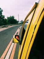 Landscape of yellow car on Road