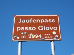 the sign by the road is red