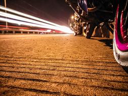 street light on the road with a motorcycle