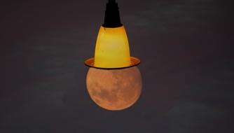 full moon and street lantern upside down