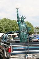 statue free on the trunk of the car