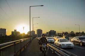 man on a motorcycle at sunset