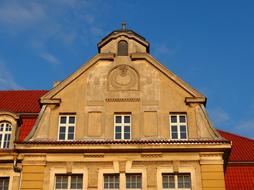 stone building with a pattern on the roof