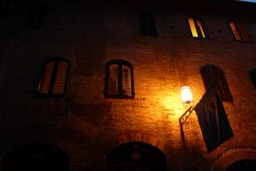 burning lantern by the building view