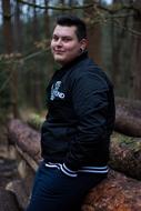 smiling man in the woods