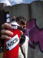 a man with a canister in his hand