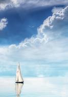 sailboat is reflected in the water on a clear day