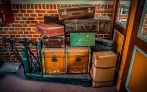 folded old suitcases at the entrance