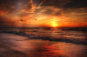 Beautiful beach of the North Sea at colorful sunset