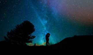 silhouette of Lovers kissing beneath Starry Sky, digital art