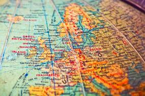 world map on a huge globe close up