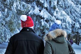 couple in a snowy forest in switzerland