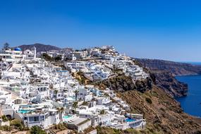 white houses on a mountainside in Santorini