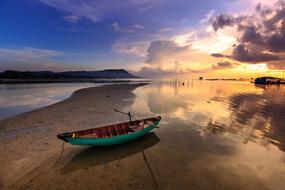 a lone fishing boat on the beach in Vietnam