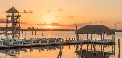 orange sunset over the piers with sun loungers