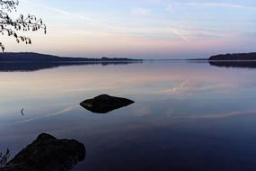 Beautiful landscape of the lake among the shore at colorful sunset in Ratzeburg, Germany