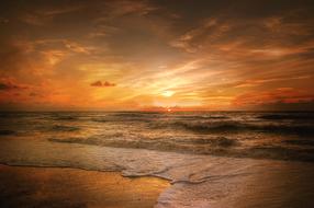 Beautiful landscape of the sandy beach, at colorful sunrise in Denmark