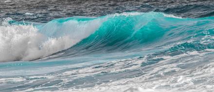 twisting turquoise ocean wave