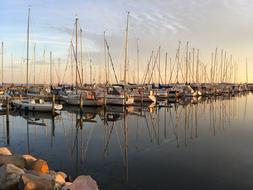 Sailing boats on the Baltic Sea, with the reflections, at colorful and beautiful sunset