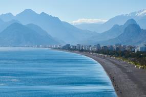 coast of the sea against the background of mountains