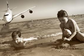 Beach Children and plane