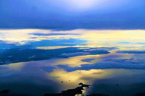 mirror reflection of clouds in the sea