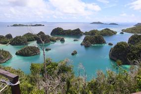 Wonderful green rocks in turquoise sea, indonesia, Raja Ampat Beach