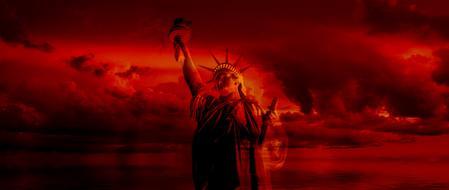 statue of liberty in the red evening sky