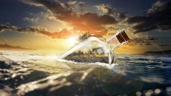 bottle with a landscape in waves as a photomontage