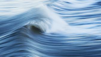 Beautiful, white waves in the blue and white ocean