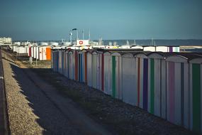 colorful striped beach cabins