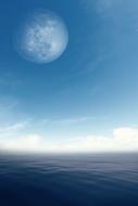 blue sea and large moon