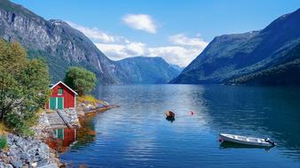 panoramic view of a hut on the fjord coast in norway