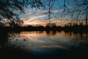 silhouettes of dusk over the lake